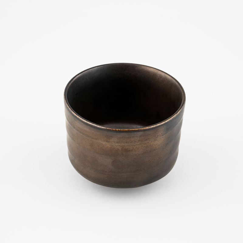 Ceramic matcha bowl on a white background.