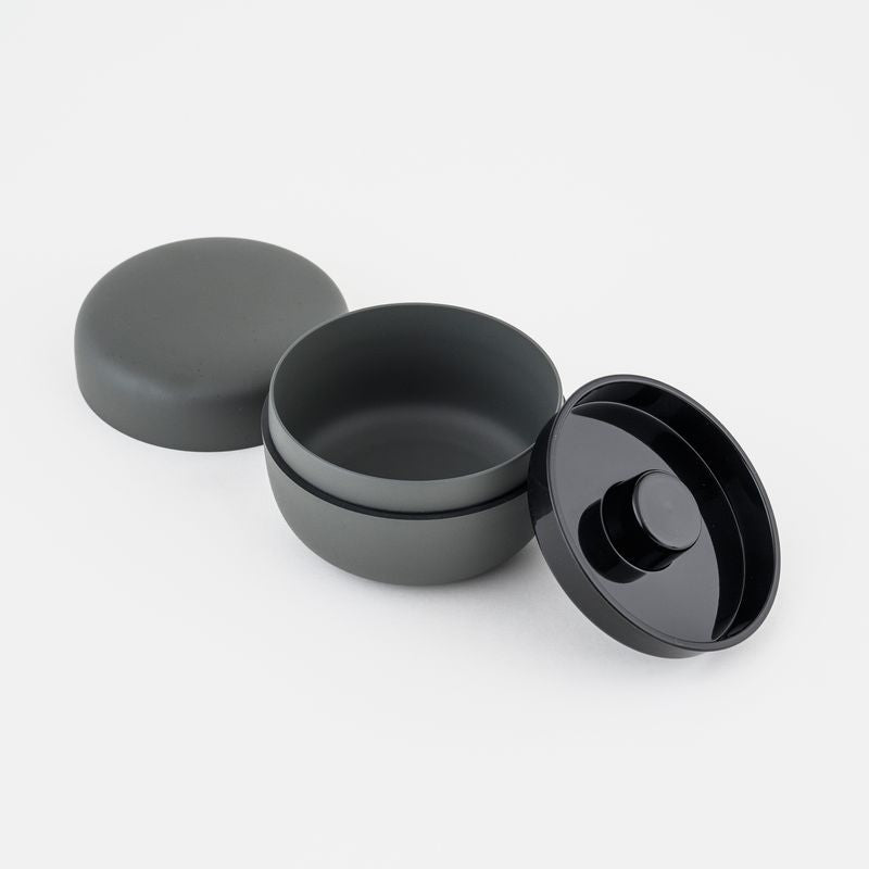 Gray ceramic tea holder with lids on a white background