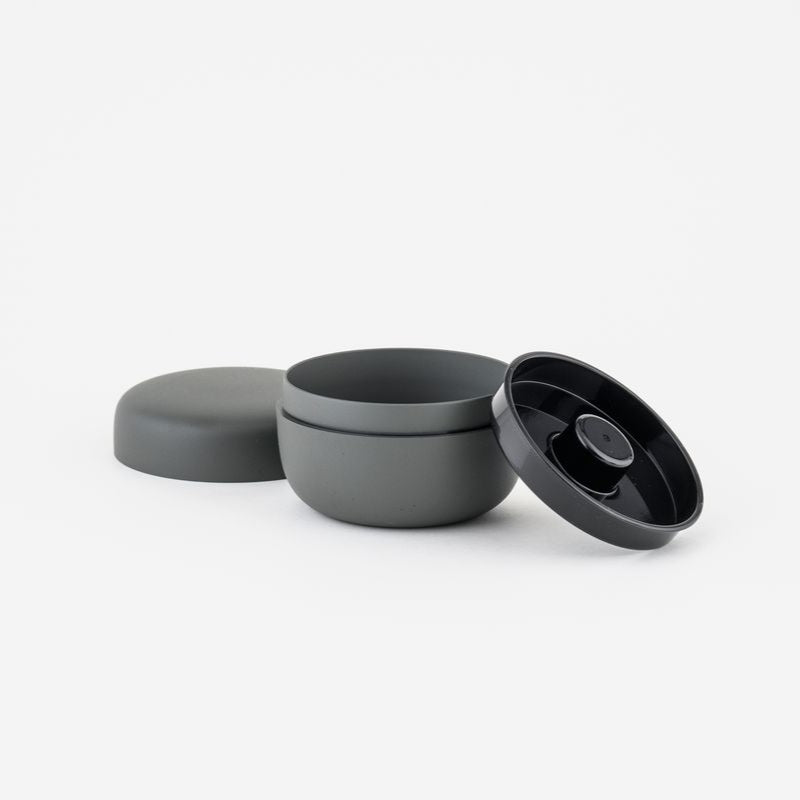 Gray container with lids on a white background