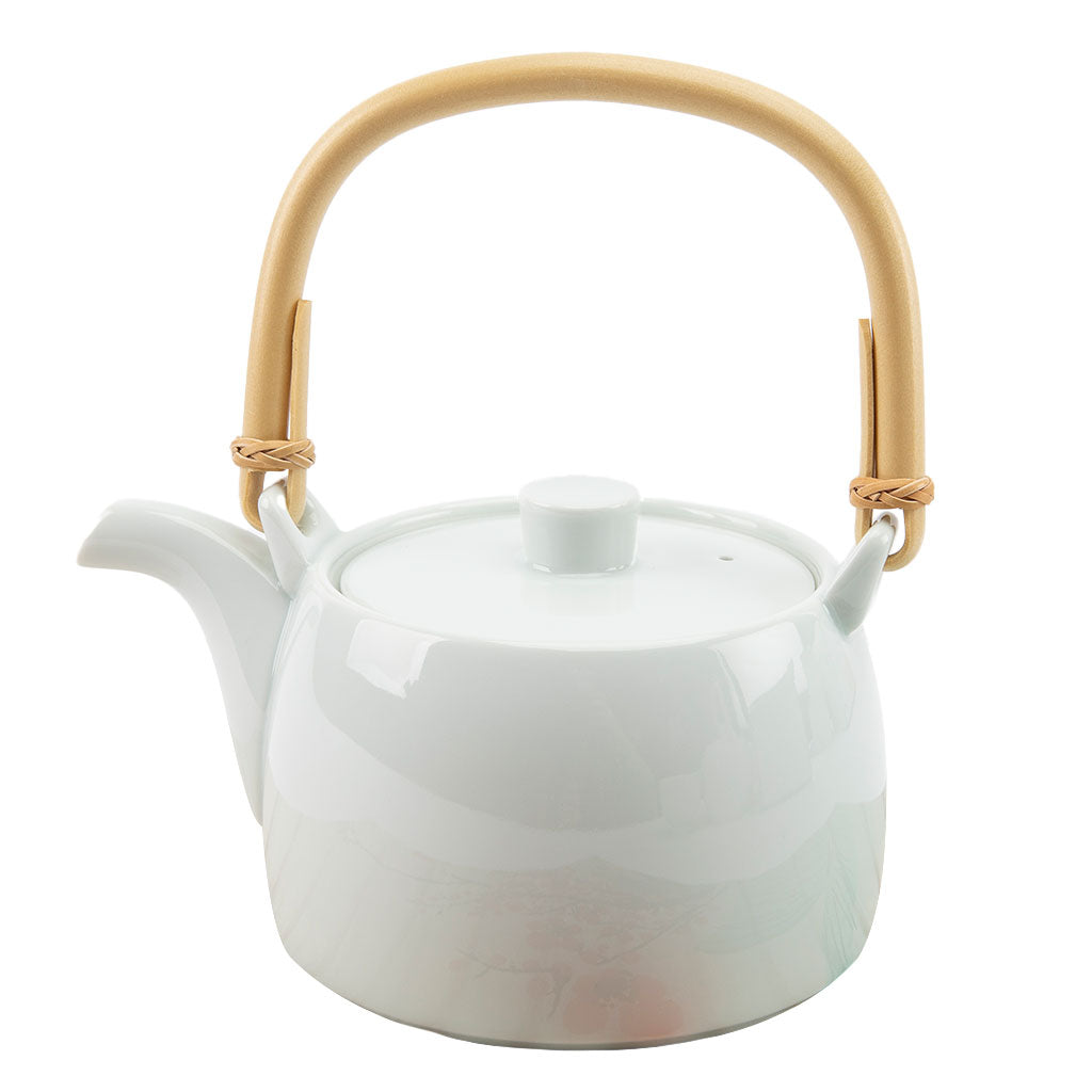 White teapot with a wooden handle on a white background