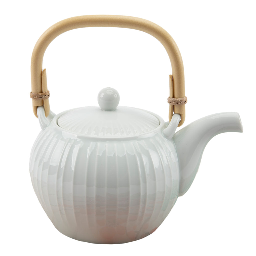 White ceramic teapot with a wooden handle on a white background