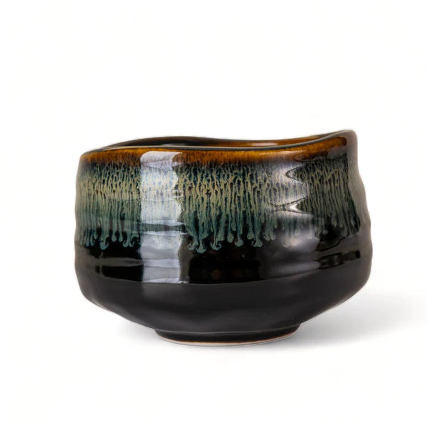 Black ceramic bowl with a gradient finish on a white background