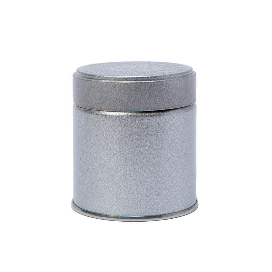 Silver cylindrical metal tin on a white background