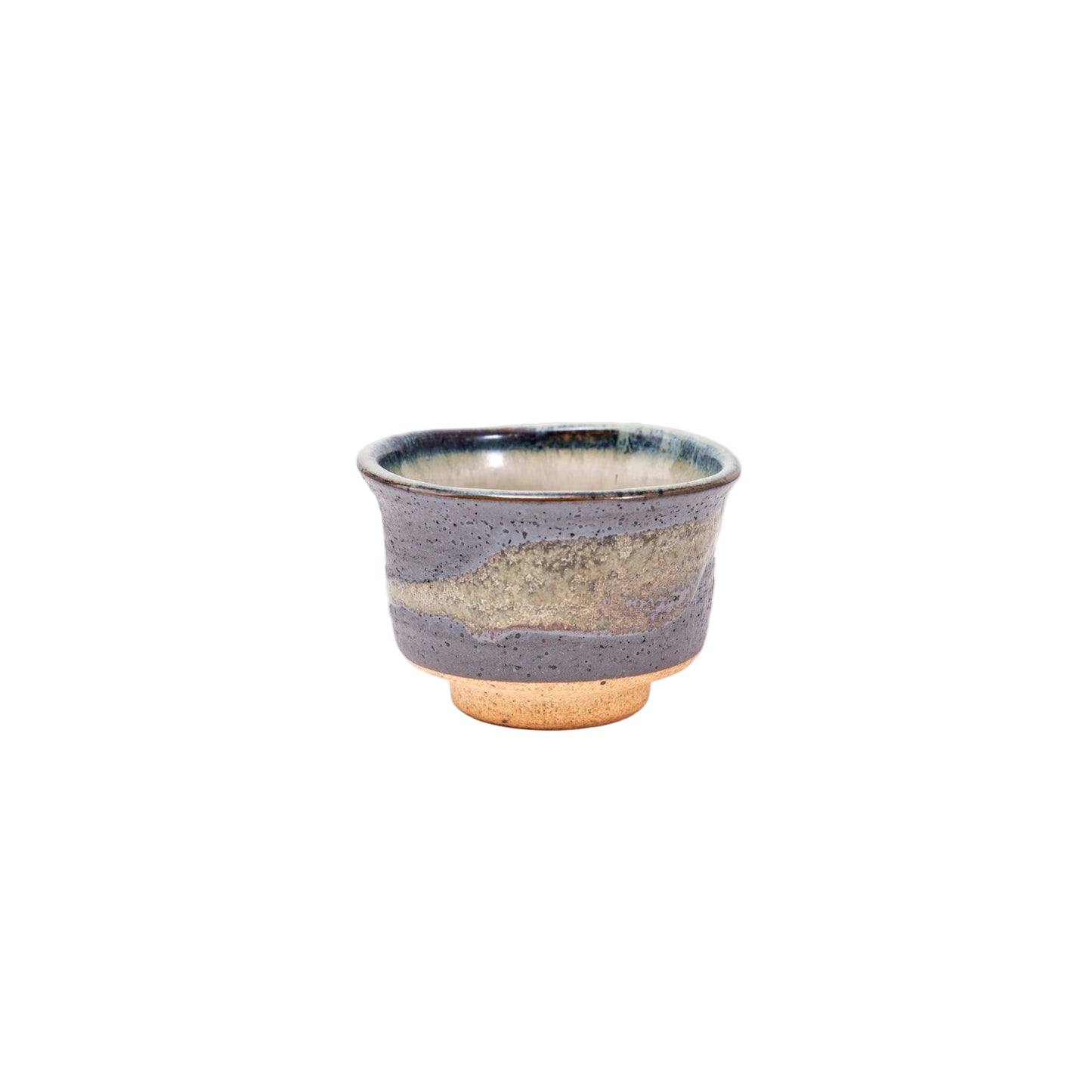 Ceramic cup with blue and gold glaze on a white background