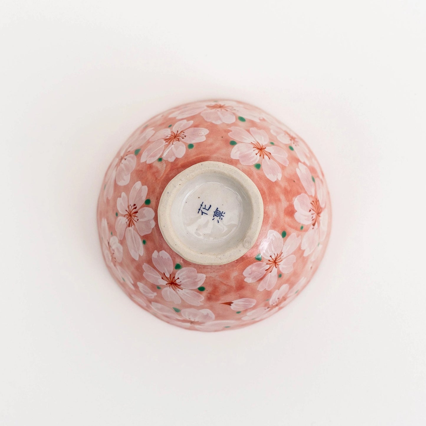 Ceramic bowl with cherry blossom design on a white background