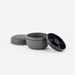 Gray container with lids on a white background