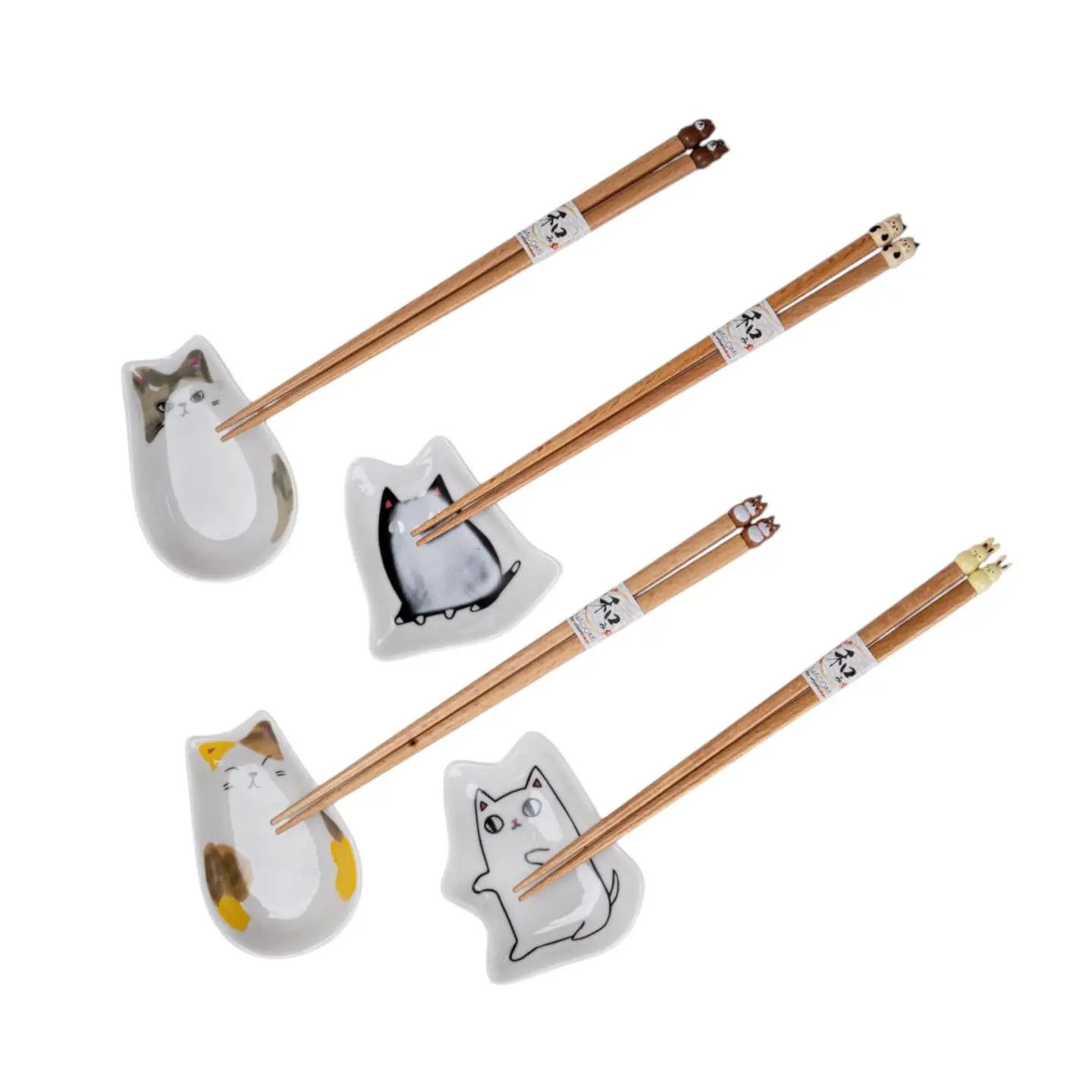 Set of chopsticks with cat-themed holders on a white background