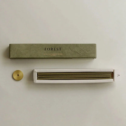Green packaging box labeled 'FOREST' with a white device on a beige background