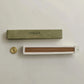 Incense set with 'FOREST' packaging on a light background
