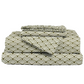 Folded fabric with wave pattern on a white background