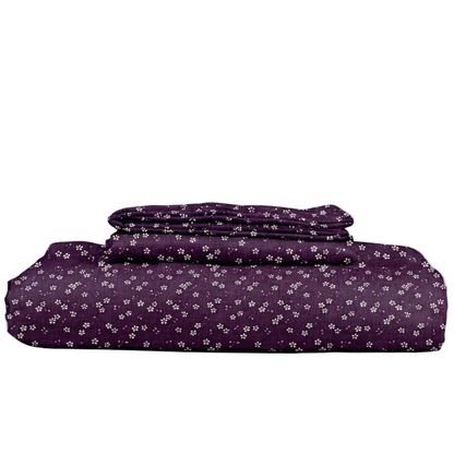 Purple floral-patterned bedding set on a white background