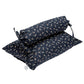 Two navy blue pillows with white patterns on a white background