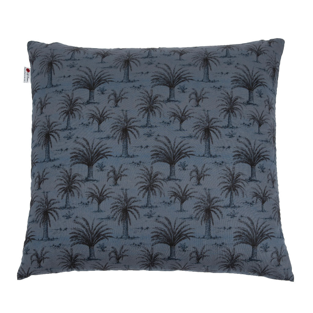 A square throw pillow featuring a dark palm tree pattern on a slate blue textured fabric, shown against a plain white background.