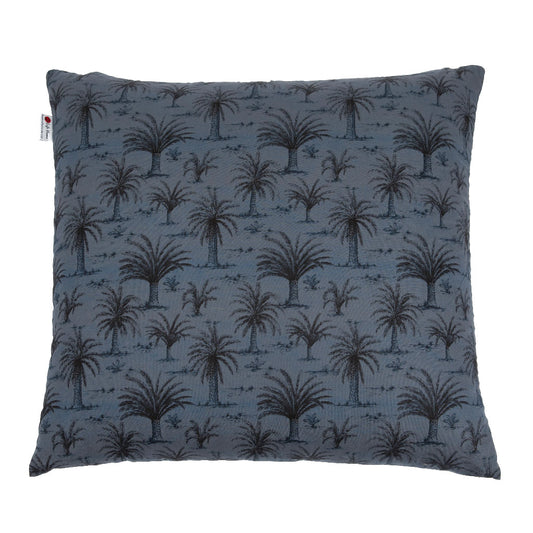 A square throw pillow featuring a dark palm tree pattern on a slate blue textured fabric, shown against a plain white background.