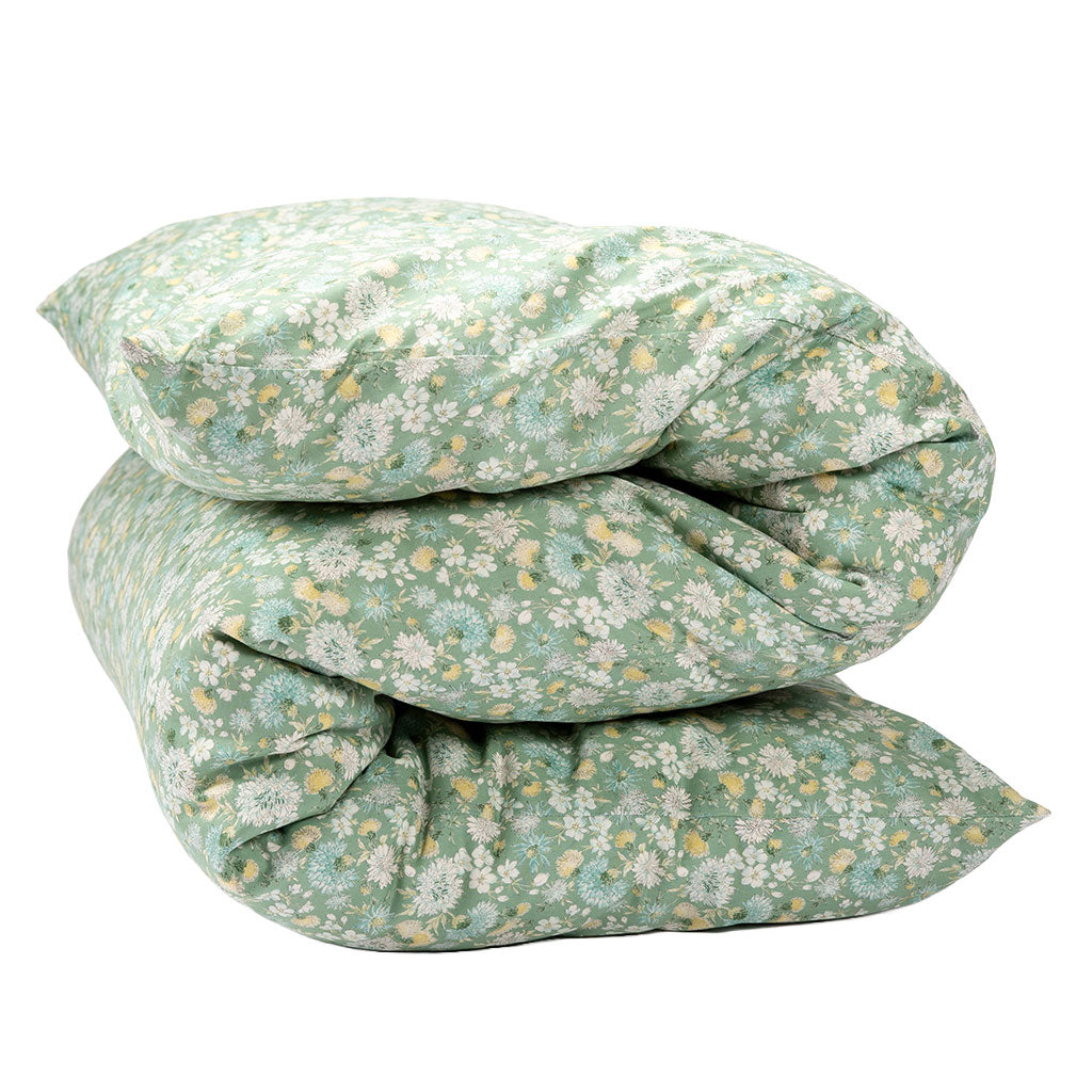 Shikifuton featuring a light sage green floral pattern with white and yellow flowers, isolated on a white background.