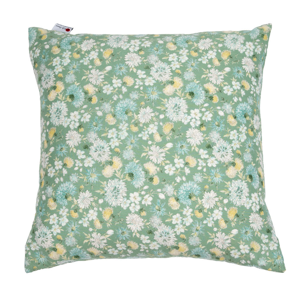 A square throw pillow featuring a dense floral print on a sage green background with white, light blue, and yellow flowers, shown against a plain white background.