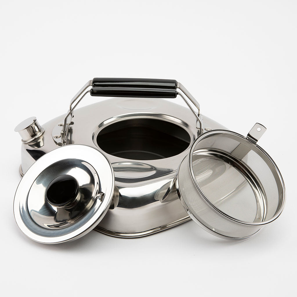 Set of stainless steel canisters with lids on a white background
