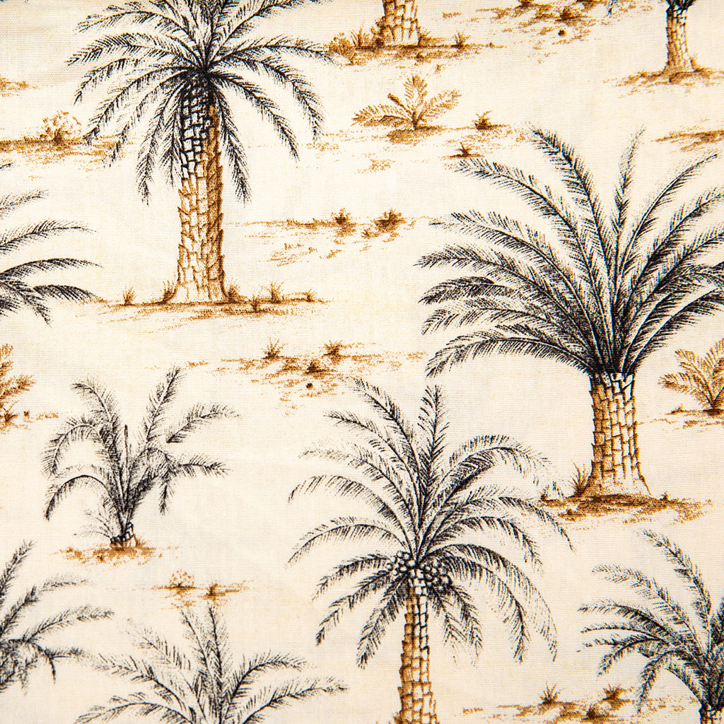 A close-up of a fabric or wallpaper pattern featuring black palm tree silhouettes and brown leafy details on a warm cream background.