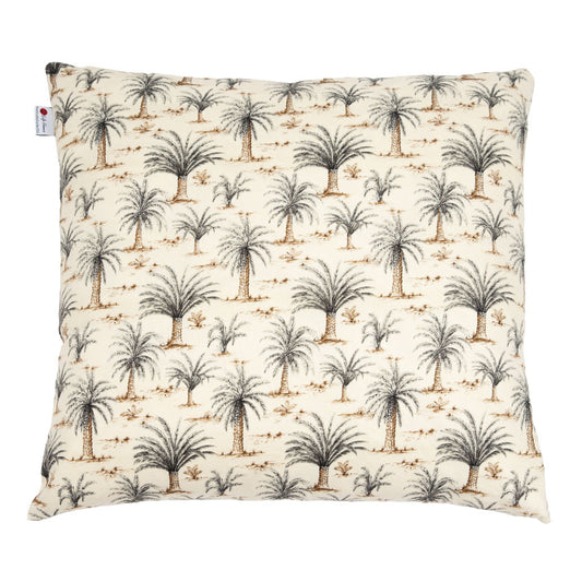A square decorative throw pillow featuring a repeating palm tree pattern on a warm cream background, with a small white brand tag on the left edge.