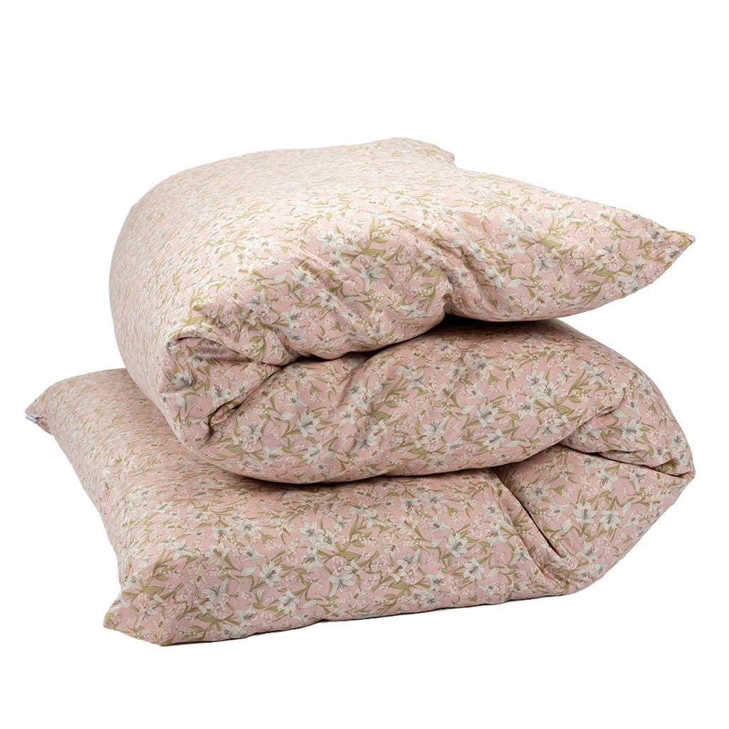 Shikifuton mattress with a light pink floral pattern cover, photographed on a clean white background.