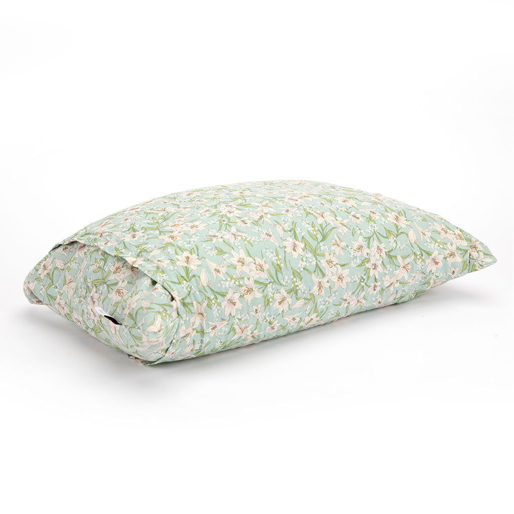A rectangular buckwheat hull pillow with a light green and white floral pattern, shown on a clean white background.