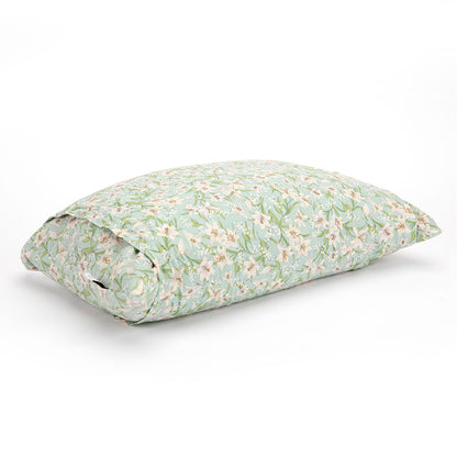 A rectangular buckwheat hull pillow with a light green and white floral pattern, shown on a clean white background.