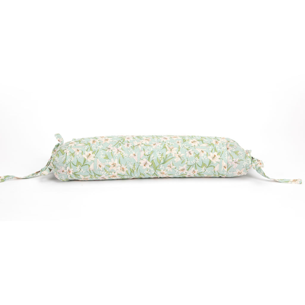 A cylindrical rectangular pillow with a light mint green and white floral pattern, featuring drawstring ties on both ends, shown against a plain white background.