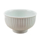 White ceramic bowl with ribbed texture on a white background