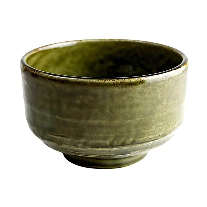 Green ceramic bowl on a white background