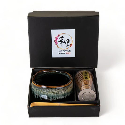 Ceramic tea bowl and whisk set in a black box with Nagomi branding.