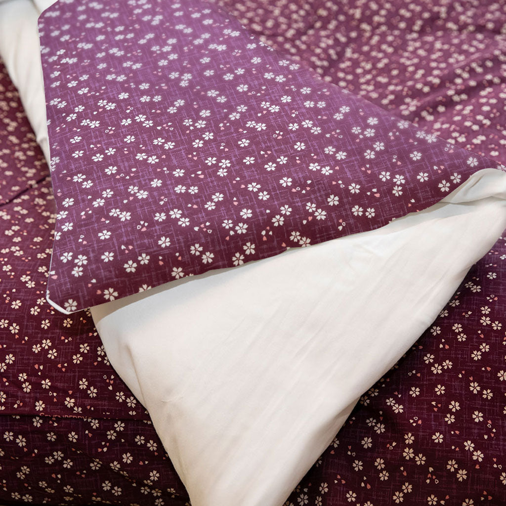 Purple fabric with white floral pattern and white fabric underneath