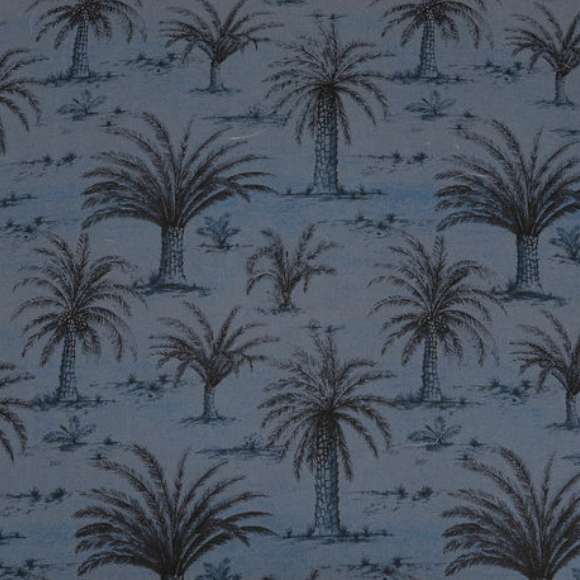 A close-up of a fabric or wallpaper pattern featuring black palm tree silhouettes on a muted blue-gray background.