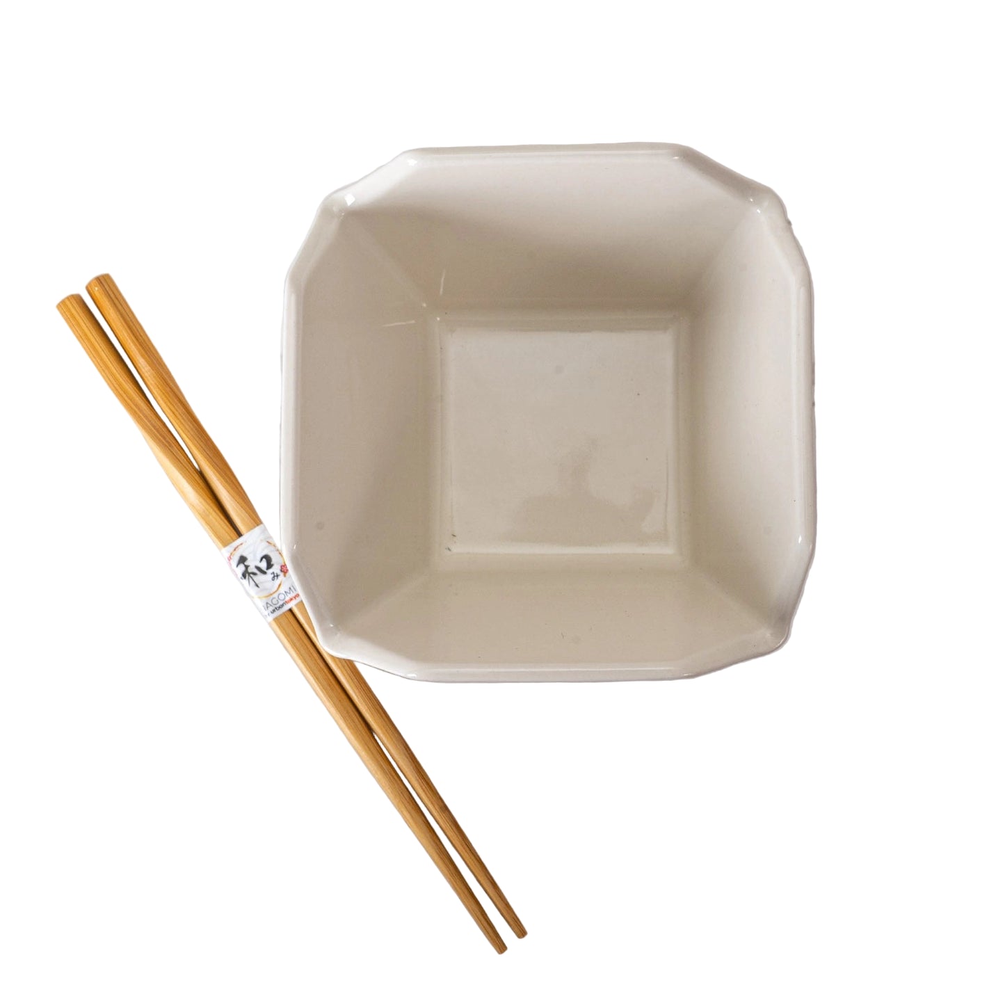 Ceramic take out box and chopsticks on a white background.