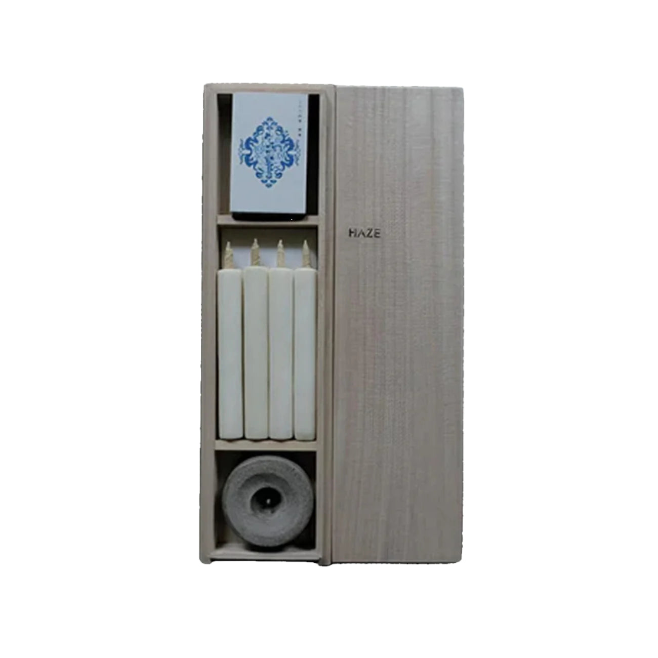 Wooden holder with candles and a small bowl on a dark textured background