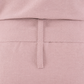Close-up of a dusty pink garment showing the back waistband with a vertical stitched tab detail.